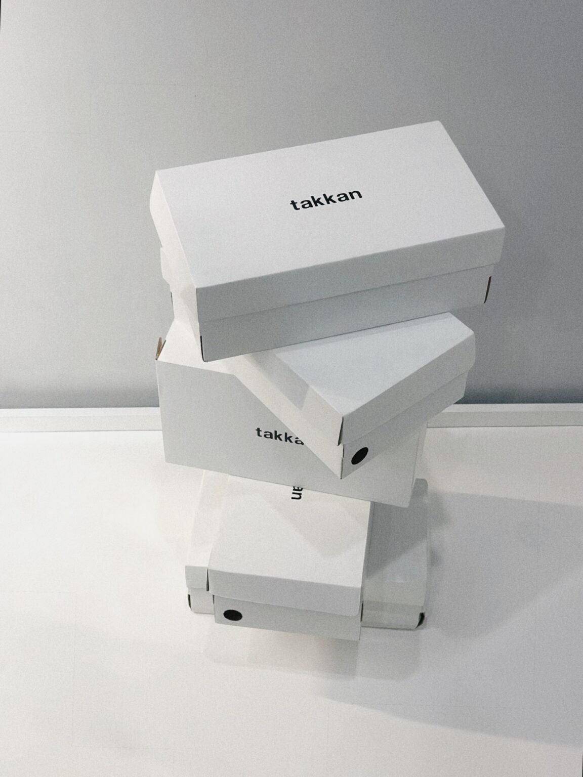 Stack of takkan shoe boxes